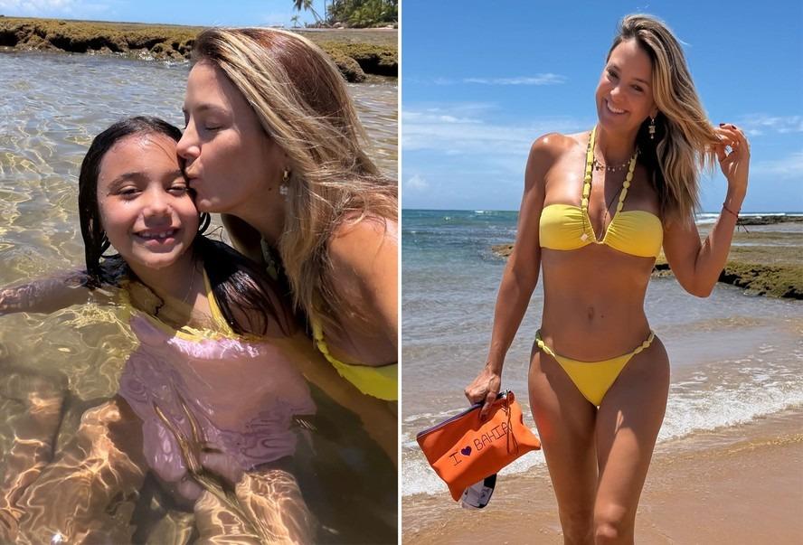 De biquíni, Ticiane Pinheiro mima a caçula em dia de praia na Bahia