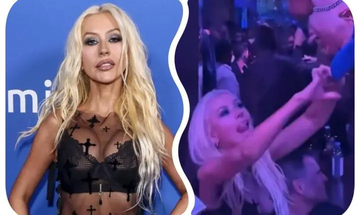 De sutiã à mostra, Christina Aguilera se diverte e 'paparica' gogoboy em evento